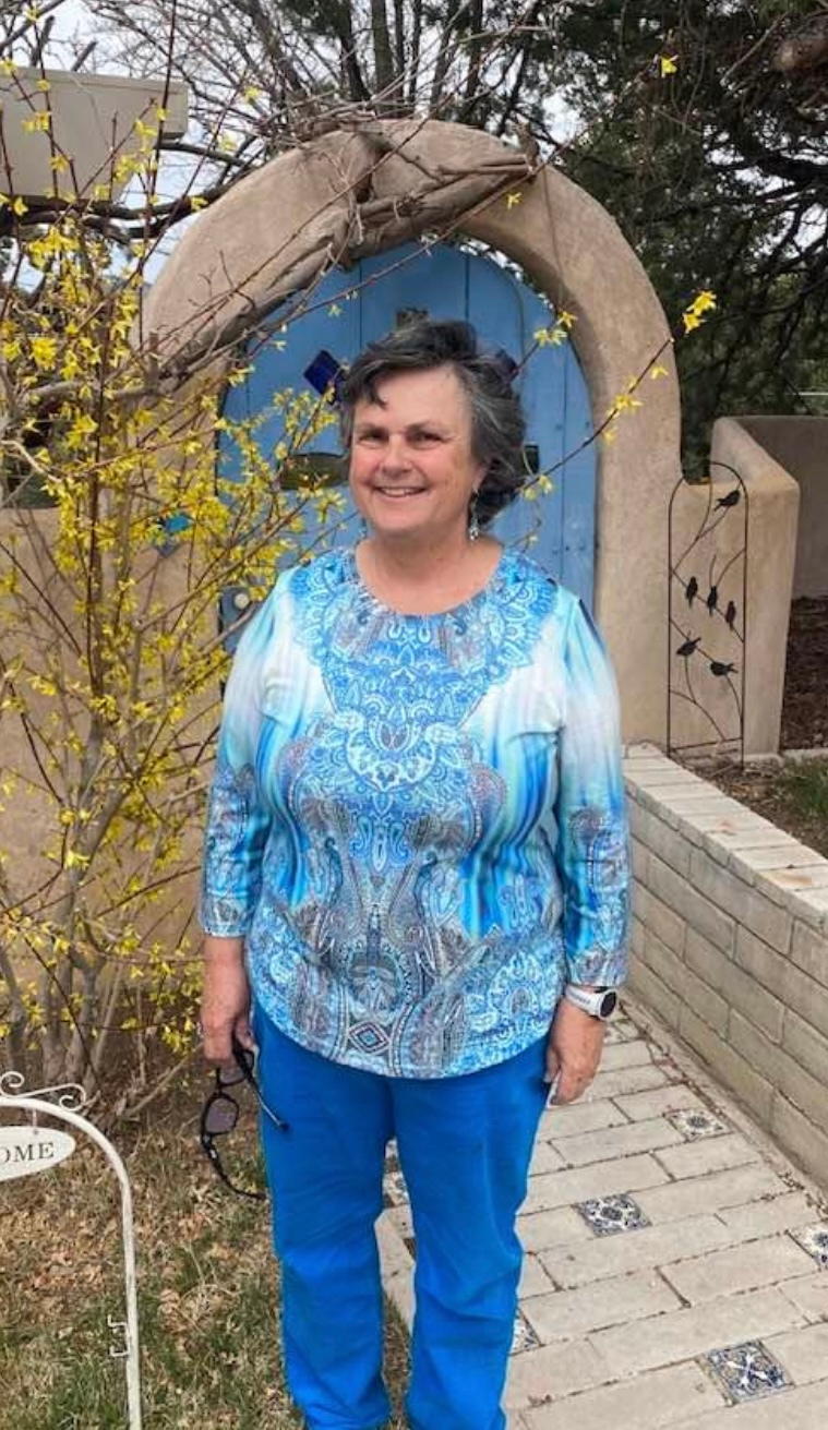 Margie from New Mexico smiling outdoors.
